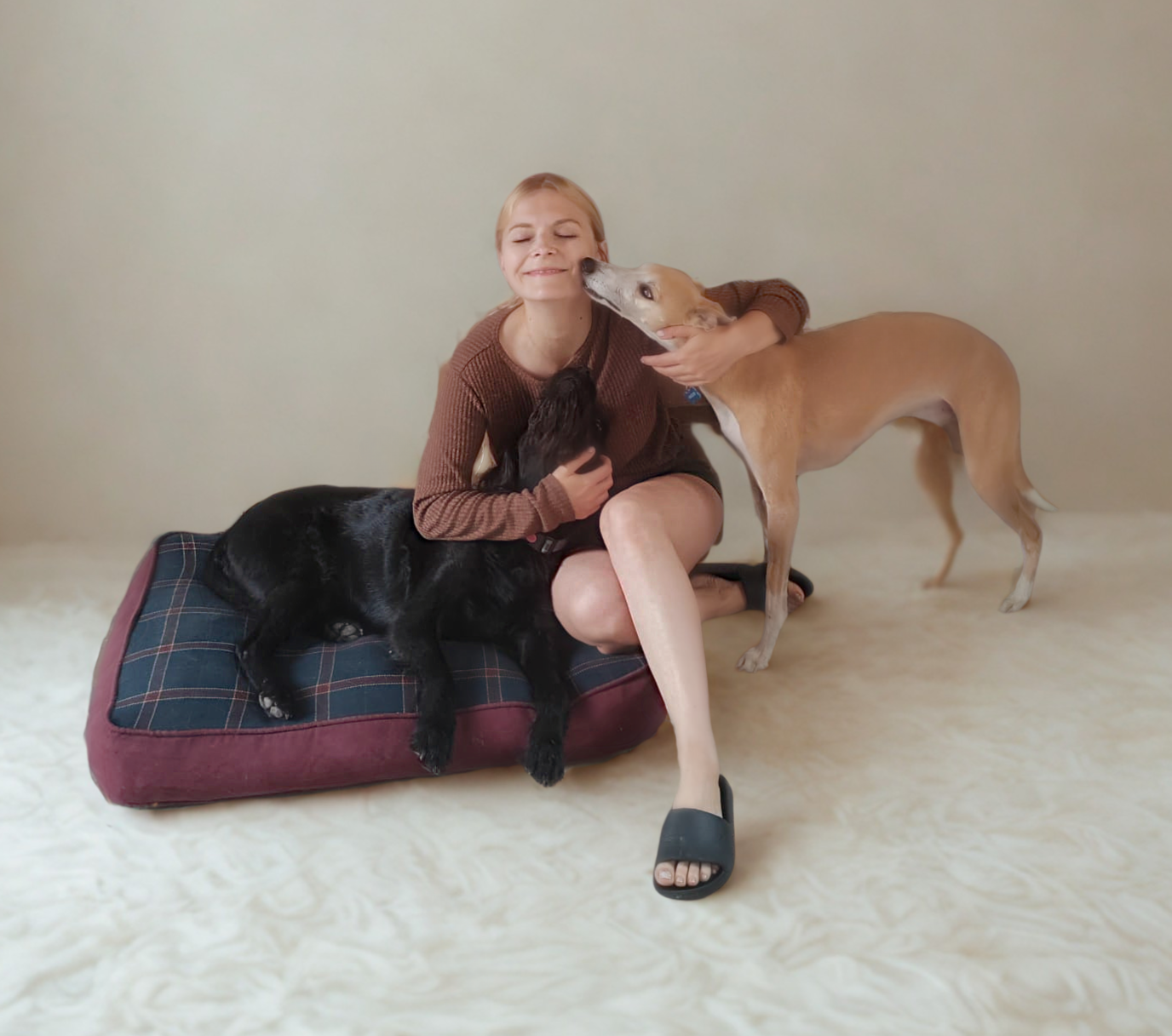 Pola sitting with two dogs